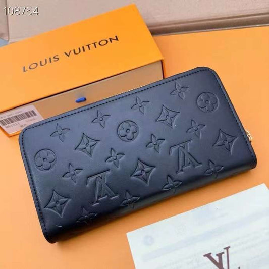 Louis Vuitton Monogram Embossed Zip Wallet in Nude Pink