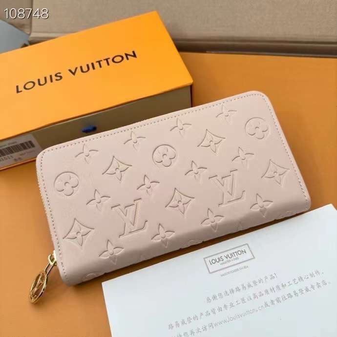 Louis Vuitton Monogram Embossed Zip Wallet in Nude Pink