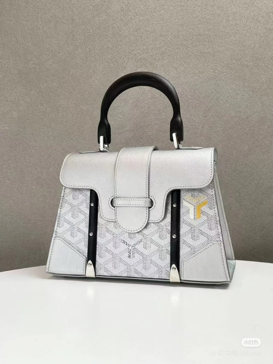 Elegant Silver Designer Handbag with Black Handle